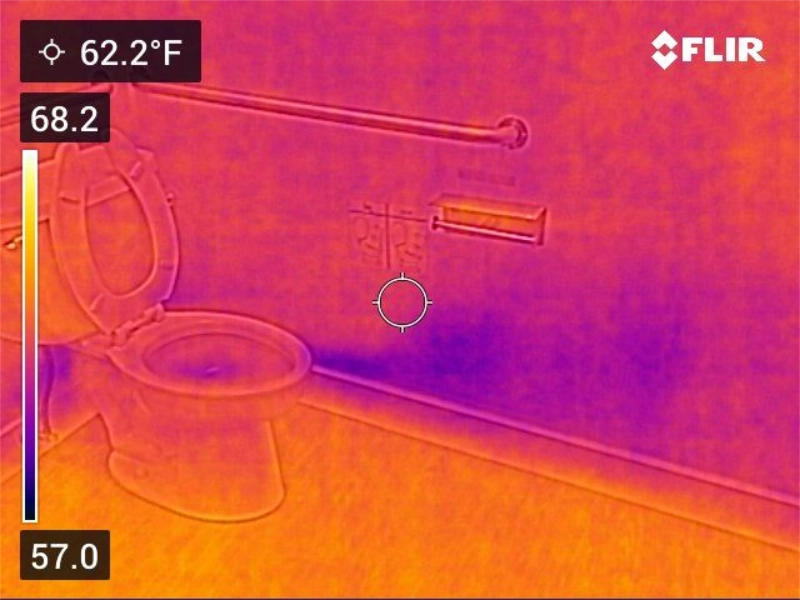 The Silent Saboteurs: 5 Hidden Water Sources Creating Mold in Your Home 2 Thermal image of a bathroom wall showing a cool area along the baseboard behind the toilet, a sign of hidden moisture